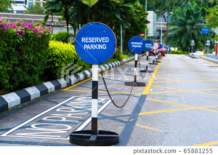 Parking blocked by signs parking reserved close 65881255