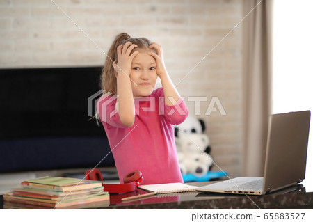 Emotional portrait of schoolgirl studying homework, home schooler Emotional portrait of schoolgirl studying homework, home schooler 65883527
