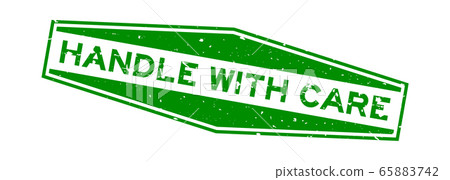 Grunge green handle with care word hexagon rubber seal stamp on white background Grunge green handle with care word hexagon rubber seal stamp on white background 65883742