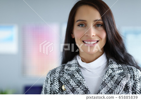 Smiling business woman in fashion jacket office Smiling business woman in fashion jacket office 65885839