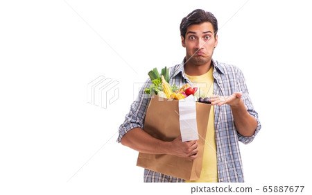 Young man with his grocery shopping on white 65887677
