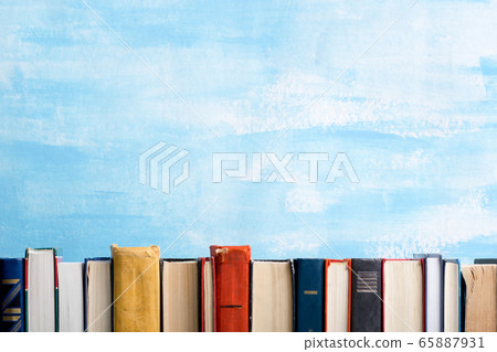 Books on wooden desk table and abstract background. Education background. Copy Space. Back to school. Books on wooden desk table and abstract background. Education background. Copy Space. Back to school. 65887931