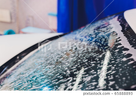 foam and soap on black background. abstract pattern. 65888893