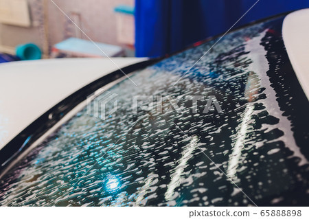foam and soap on black background. abstract pattern. foam and soap on black background. abstract pattern. 65888898