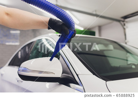 Car interior textile seats chemical cleaning with professionally extraction method. Early spring cleaning or regular clean up. 65888925