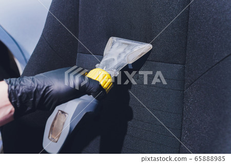 Car interior textile seats chemical cleaning with professionally extraction method. Early spring cleaning or regular clean up. Car interior textile seats chemical cleaning with professionally extraction method. Early spring cleaning or regular clean up. 65888985