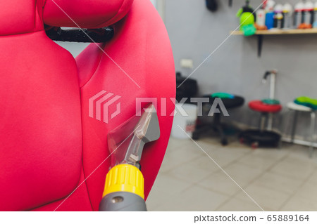 Car interior textile seats chemical cleaning with professionally extraction method. baby pink seats. Car interior textile seats chemical cleaning with professionally extraction method. baby pink seats. 65889164