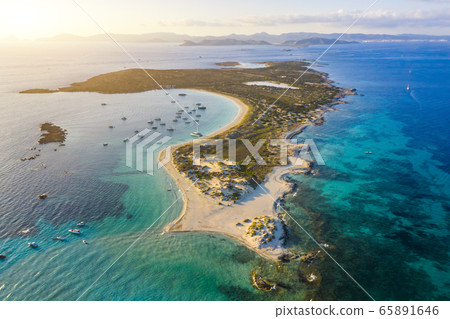 Aerial view over the clear beach and turquoise water of Formentera, Ibiza. 65891646