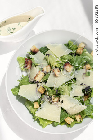 caesar salad with parmesan cheese and croutons on caesar salad with parmesan cheese and croutons on 65892298