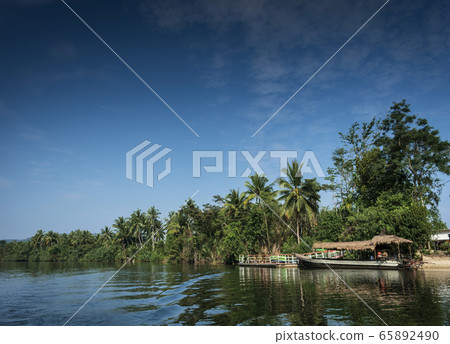 traditional jungle boat at pier on tatai river in traditional jungle boat at pier on tatai river in 65892490