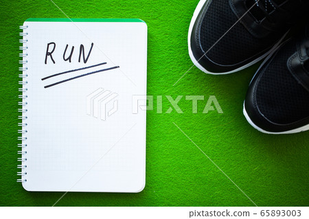 Stylish black fashion sneakers on green background. Stylish black fashion sneakers on green background. 65893003