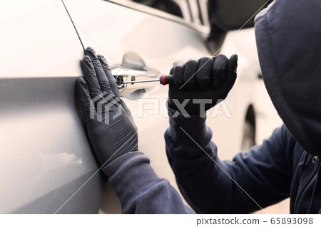 The robber is stealing the car The robber is stealing the car 65893098