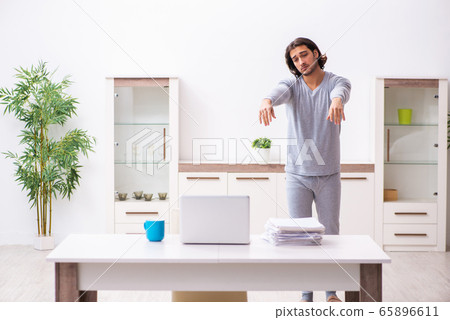 Young male employee freelancer working from home Young male employee freelancer working from home 65896611