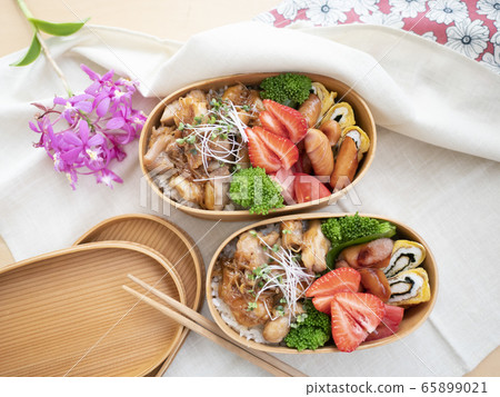 Two colorful lunch boxes lined up on the table Two colorful lunch boxes lined up on the table 65899021