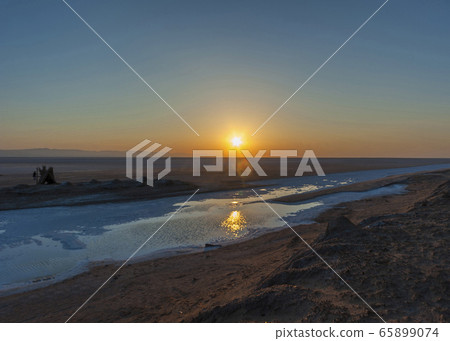 Sunrise over the salt lake of El Jerid. Sunrise over the salt lake of El Jerid. 65899074