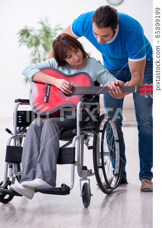 Disabled wife and young husband at home Disabled wife and young husband at home 65899199