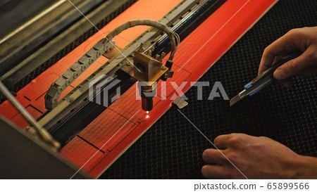 Industrial laser engraving on a paperboard Industrial laser engraving on a paperboard 65899566