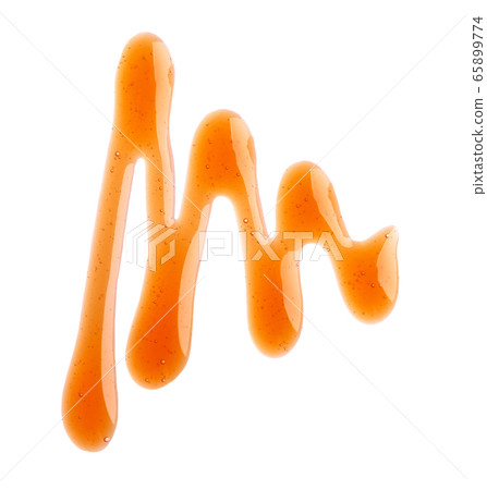 Caramel syrup drizzle isolated on white 65899774