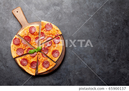 Tasty homemade pizza with pepperoni Tasty homemade pizza with pepperoni 65900137