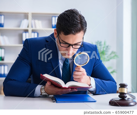 Lawyer working in his office 65900477
