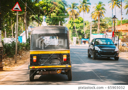 Goa, India. Auto Rickshaw Or Tuk-tuk Moving On Street. Back View 65903032
