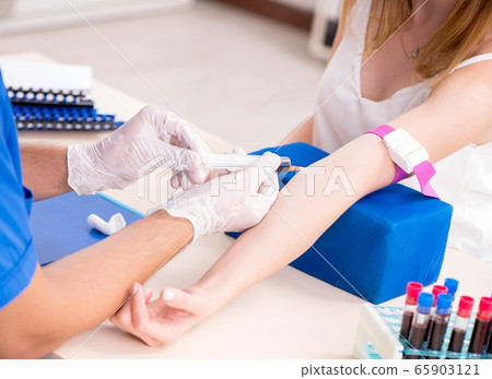 Young patient during blood test sampling procedure 65903121