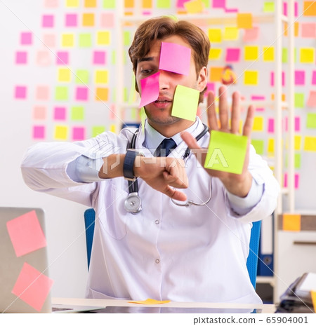 Male doctor with many conflicting prioritites Male doctor with many conflicting prioritites 65904001