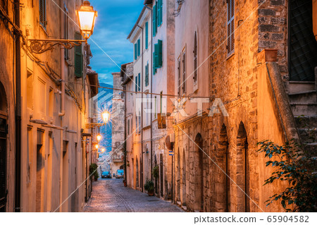 Terracina, Italy. Night Evening View Of Old Street In Illuminations Terracina, Italy. Night Evening View Of Old Street In Illuminations 65904582