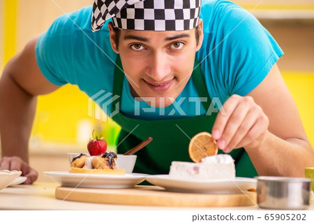 Man cook preparing cake in kitchen at home 65905202