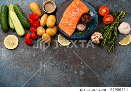 Raw salmon fillet and vegetables Raw salmon fillet and vegetables 65906534