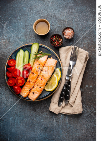 Fried salmon steak and vegetables Fried salmon steak and vegetables 65906536