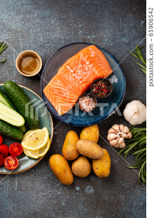 Raw salmon fillet and vegetables Raw salmon fillet and vegetables 65906542