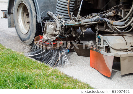 special car cleans the road 65907461