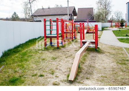 quarantined playground on spring day 65907467