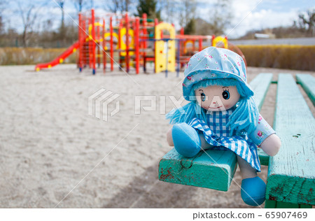 forgotten toy doll in the empty quarantined 65907469