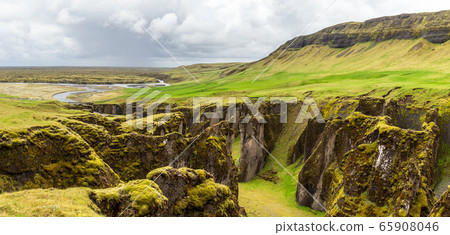 Fjadrargljufur canyon steep cliffs and waters of 65908046