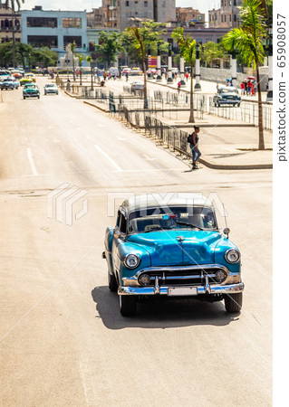 Old vintage blue retro car on the road in the 65908057