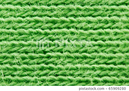 Close-up of texture fabric. Green cloth textile 65909280