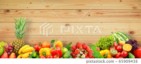 Fresh fruits and vegetables on wooden wall 65909438