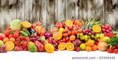 Different fruits and vegetables on dark wooden 65909440