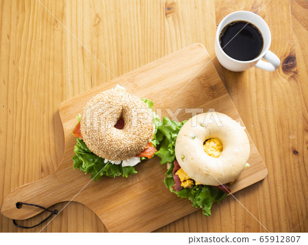 Bagel sandwich bacon egg salmon cream cheese 65912807