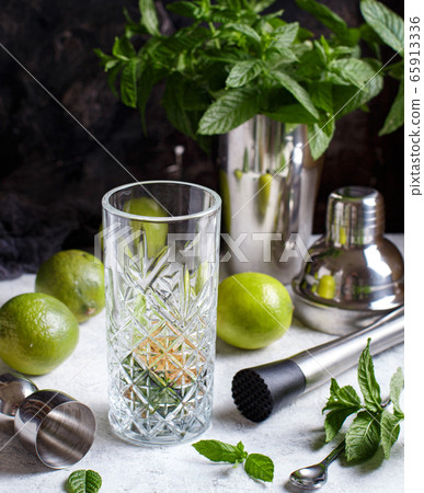 Mojito cocktail making with barmen tools 65913336