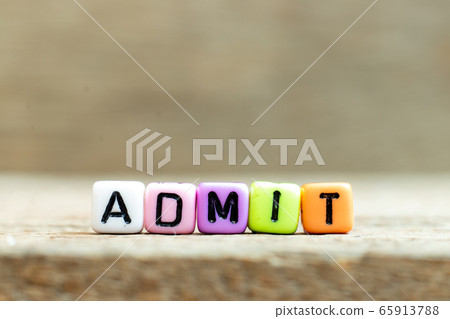 Colorful bead with black letter in word admit on wood background 65913788