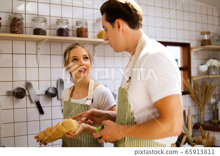 Young couples are enjoying cooking at the kitchen in working from home, COVID-19. 65913811