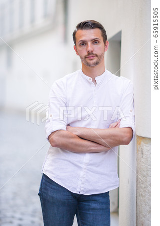 Young man background the old european city take selfie Young man background the old european city take selfie 65915505