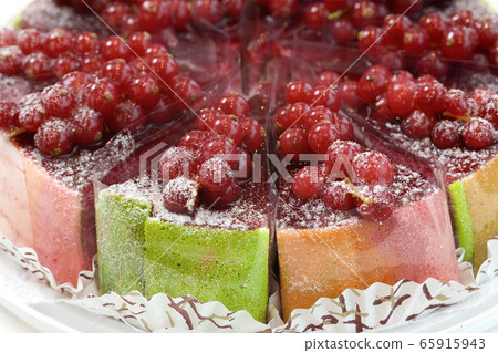 Fresh fruit cake with red currant sliced in 65915943