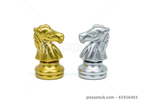 Closeup silver and gold horse chess pieces  in a 65916403