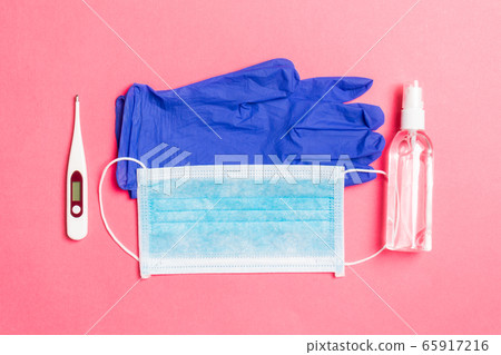 Top view of latex gloves, bottle of alcohol hand 65917216