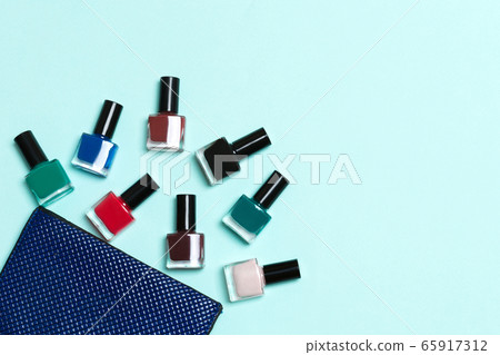 Top view of the set of nail polishes and bright Top view of the set of nail polishes and bright 65917312