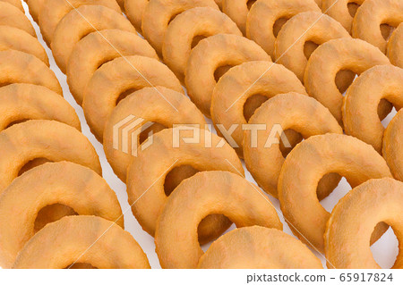 3D Render - Stack of fried donuts without topping. Doughnuts deep fried from a flour dough. 3D Render - Stack of fried donuts without topping. Doughnuts deep fried from a flour dough. 65917824